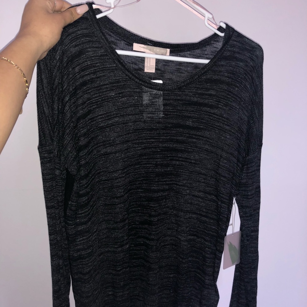 A knit top in the color black
